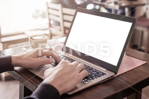 Man typing on laptop keyboard with isolated screen for mockup PSD Template