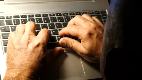 Man Typing on a Laptop Keyboard Late at Night Stock Footage 213279882