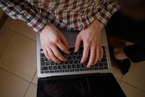 Man typing on laptop keyboard, work and business concept Stock Photos