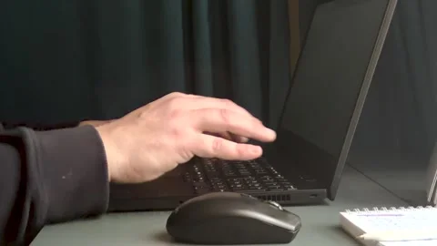 Man typing on laptop keyboard working in home. Freelancer works on a laptop Vídeo Stock 331494194