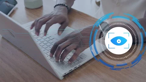 Man typing laptop keys, launching HUD eye overlay, picking handheld device for Stock Footage 335282388