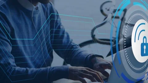Man typing laptop, lock and net lines appearing on screen, securing tech data Stock Footage 334884211
