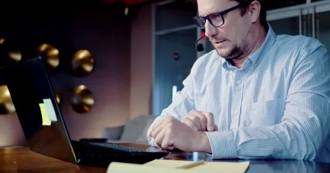 Man Typing on Laptop in Modern Office Stock Footage 323681084
