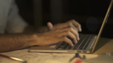 Man typing on laptop at night 4k Video stock 147495007
