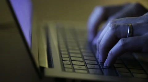 Man typing on a laptop at night time in dark space. Stock Footage 51709354
