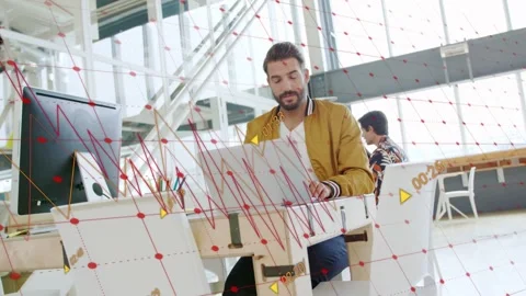 Man typing laptop office, graphics moving causing pullback, passerby occluding, Video stock 334014091