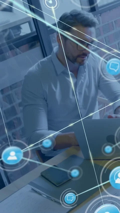 Man typing on laptop in office, starting data flow to tech network, blue icons Stock Footage 330430234