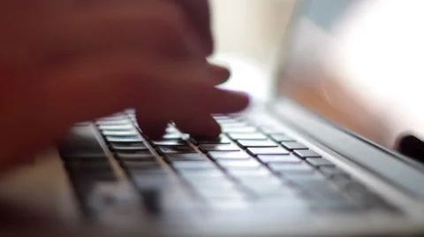 A man typing on a laptop, shallow depth of field Stock Footage 49525603