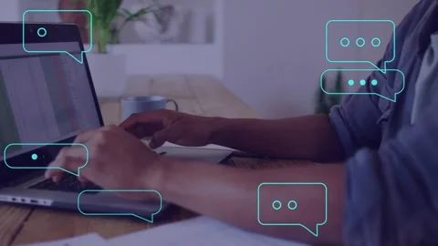 Man typing laptop spreadsheet, starting growing turquoise chat bubbles over Stock Footage 334768341