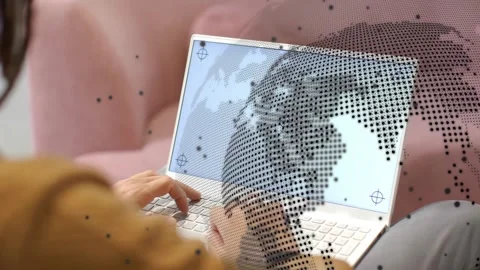 Man typing on laptop, starting rotating globe moving right and marking data Stockbeeldmateriaal 331379867