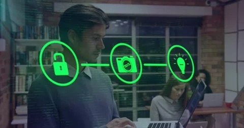 Man typing on laptop in tech hub, causing green lock camera bulb icons linking Stock Footage 331832745
