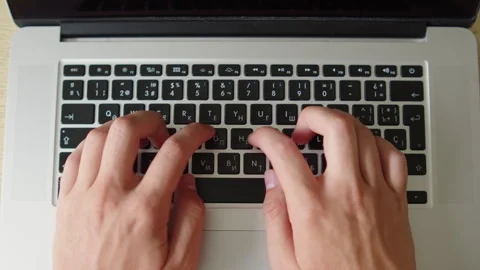 Man typing on a laptop. Top down close up shot of a person actively typing .. Stock Footage 339859382