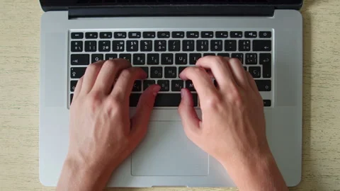 Man typing on a laptop. Top down close up shot of a person actively typing .. Stock Footage 339859645