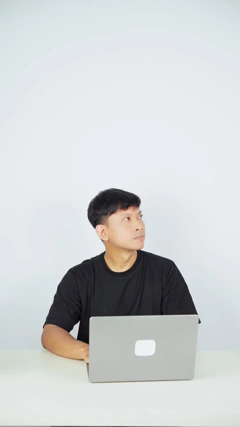 Man Typing on Laptop on White Background Video stock 347105589
