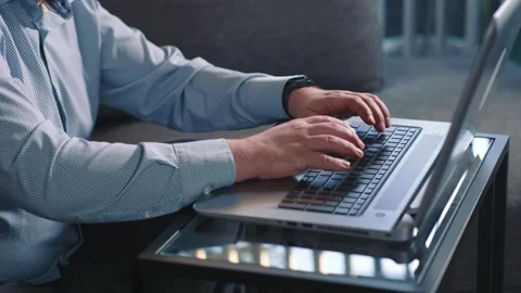 Man typing on laptop working remotely from home Stock Footage 340203999