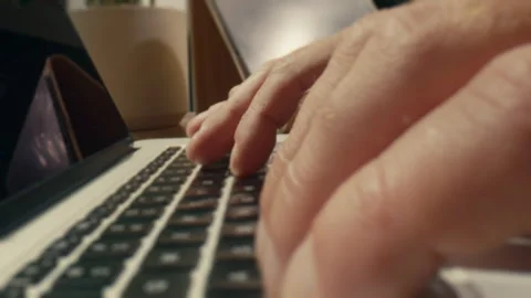 Man typing on a laptop's keyboard Stock Footage 275512081