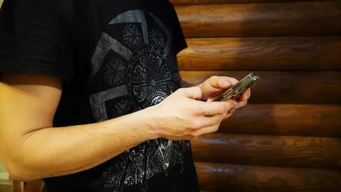 Man typing a message on a cell phone Stock Photos