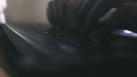Man typing a message on a laptop at night Video stock 66655097