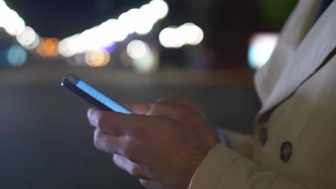 Man typing message on mobile phone Stock Footage 104411753