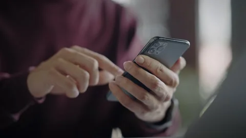 Man typing message on modern smartphone. Hands close-up. Slow motion Stock Footage 344800299
