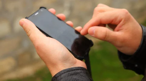 Man typing a message on a smartphone Stock Footage 50129223