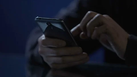 Man typing message on smartphone, wasting time at night party, hands closeup Stock Footage 71658899