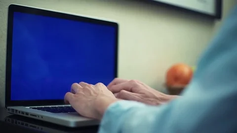 Man typing message using laptop with green screen. Freelancer working at home. Stock Footage 82933526