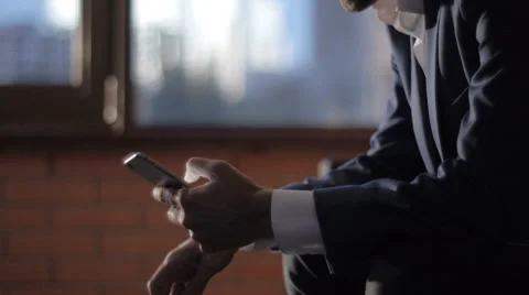 Man Typing a Message Using Mobile Phone at Evening Time in Coffee House 스톡 동영상 64254710