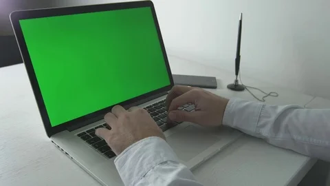 Man typing on notebook 動画素材 69853475