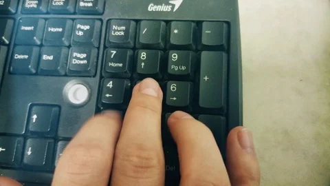 Man Typing Numbers On Computer Keyboard Stock-Footage 86422745