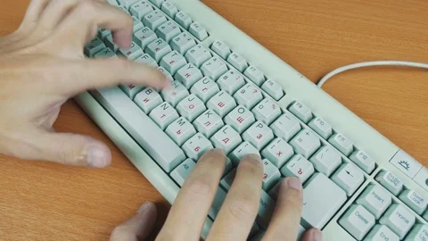 Man typing on an old computer keyboard Stock Footage 70170036