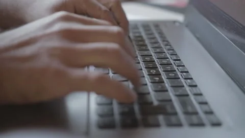 Man typing on old notebook with shallow depth of field  Stock Footage 138783353