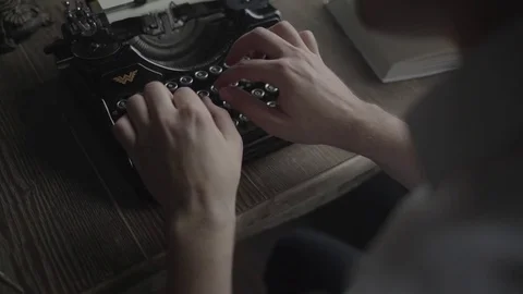 A man typing on old typewriter close-up Stock-Footage 72634005
