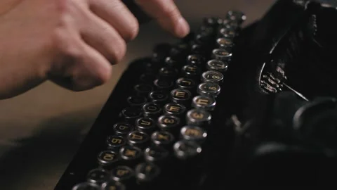 Man typing on old typewriter. Stationary Cinematic Isolated typewriter shot. Stock Footage 134807810