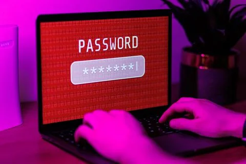Man typing password on personal computer. Close up shot of cybersecurity concept Stock Photos