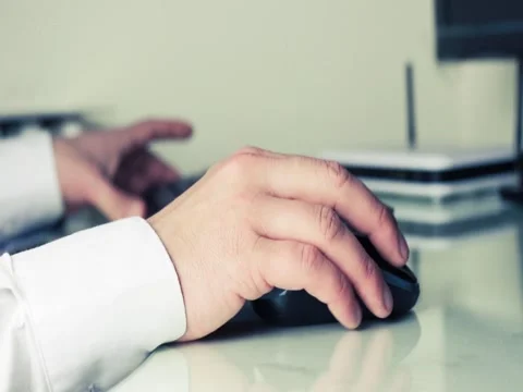 Man typing on a pc keyboard and using mouse, technology business concept Stock Footage 46980817