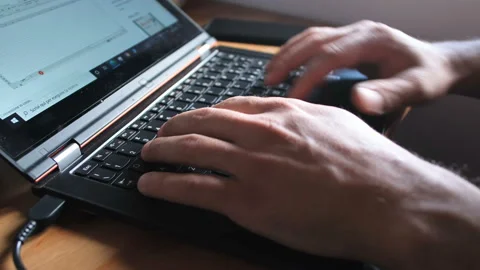 Man Typing On pc Keyboard while working on web in coronavirus pandemic disease Stock Footage 136021082