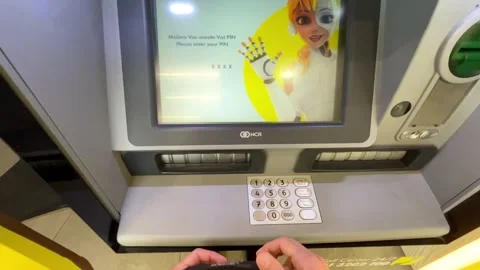 Man typing pin code on the keyboard at an ATM Stock Footage 241176908