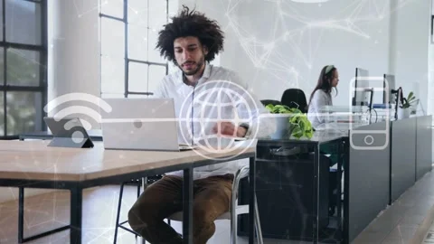 Man typing, reaching tablet in office overlay network icons drawing woman for Stock Footage 334322123
