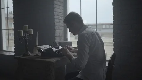 Man typing on retro typewriter in the studio Stock-Footage 72634539
