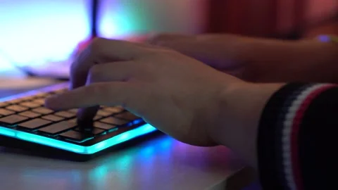 Man is Typing on a RGB Keyboard Stock Footage 194244773