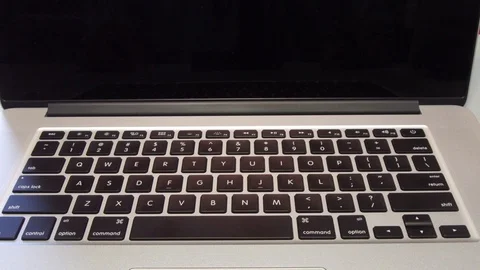 Man Typing the Shift Key on Laptop Computer Stock Footage 86482094