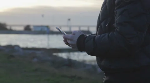 Man typing on a smartphone Stock Footage 56931782