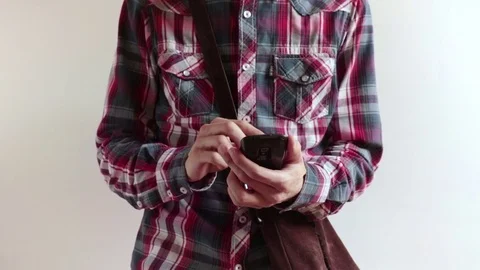 Man typing on smartphone on white background Stock Footage 79272721