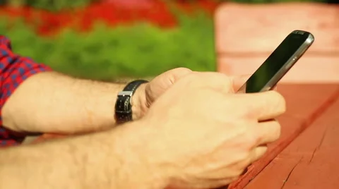 Man is typing sms on the phone Stock Footage 65813017