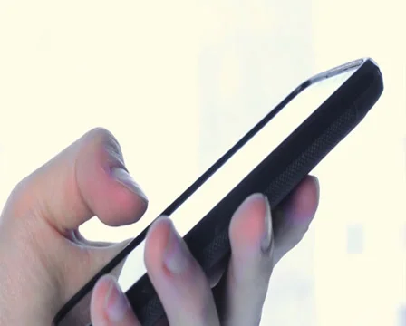 Man typing sms on touch phone using left hand, close-up Stock Footage 36777391
