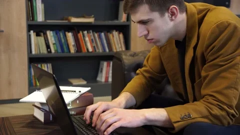Man typing something on laptop keyboard Stock Footage 155963251