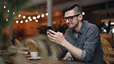 Man Typing Something on Smartphone 動画素材 103747091