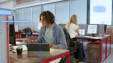 Man typing on tablet in business office, faint blue UI overlaying screen while Stock Footage 333019307