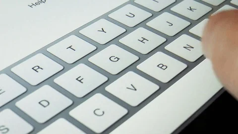 Man is typing on a tablet Stock Footage 78913794